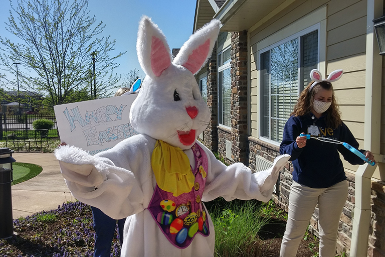 The Easter Bunny dancing with a Crown Hospice volunteer at Life Care Center of Cape Girardeau, Missouri