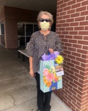 Sheri Fowler, area community relations director, with a goody bag to deliver