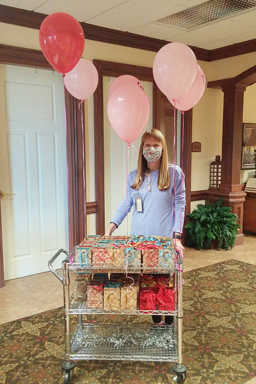 Cheryl Guetersloh, activity director at Life Care Center of Cape Girardeau, delivering gift bags