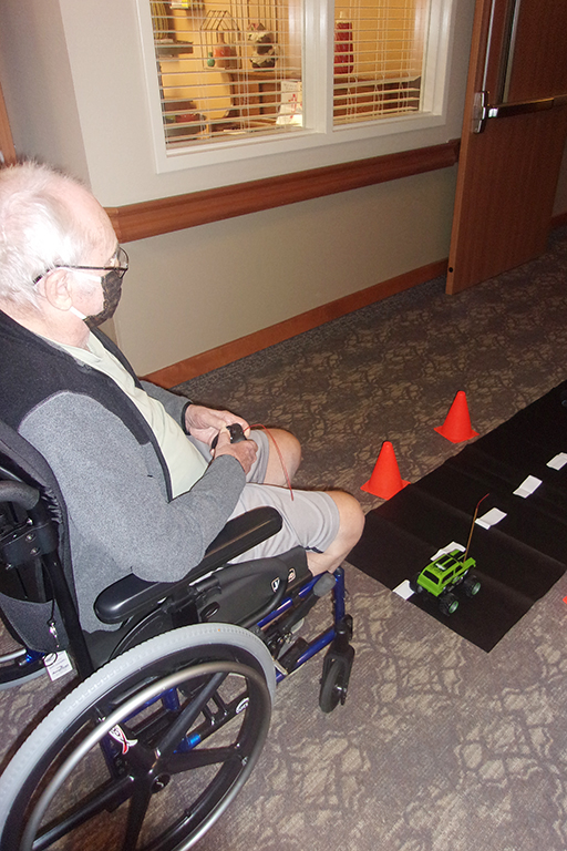 Robert Munday, resident at Cottesmore of Life Care, racing an RC car