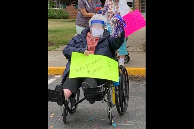 Resident Adrienne Comtois watches the parade.