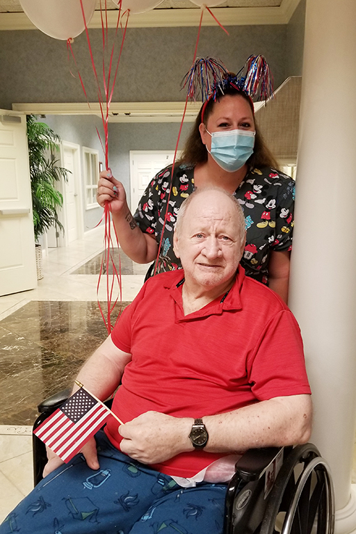 Resident Bruce Ellis with Amie Downing, activity specialist, at Life Care Center of Palm Bay