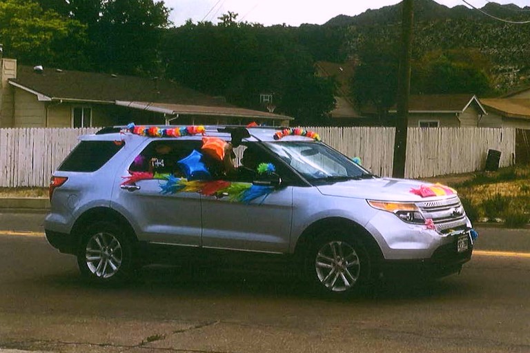 A decorated vehicle drives by.