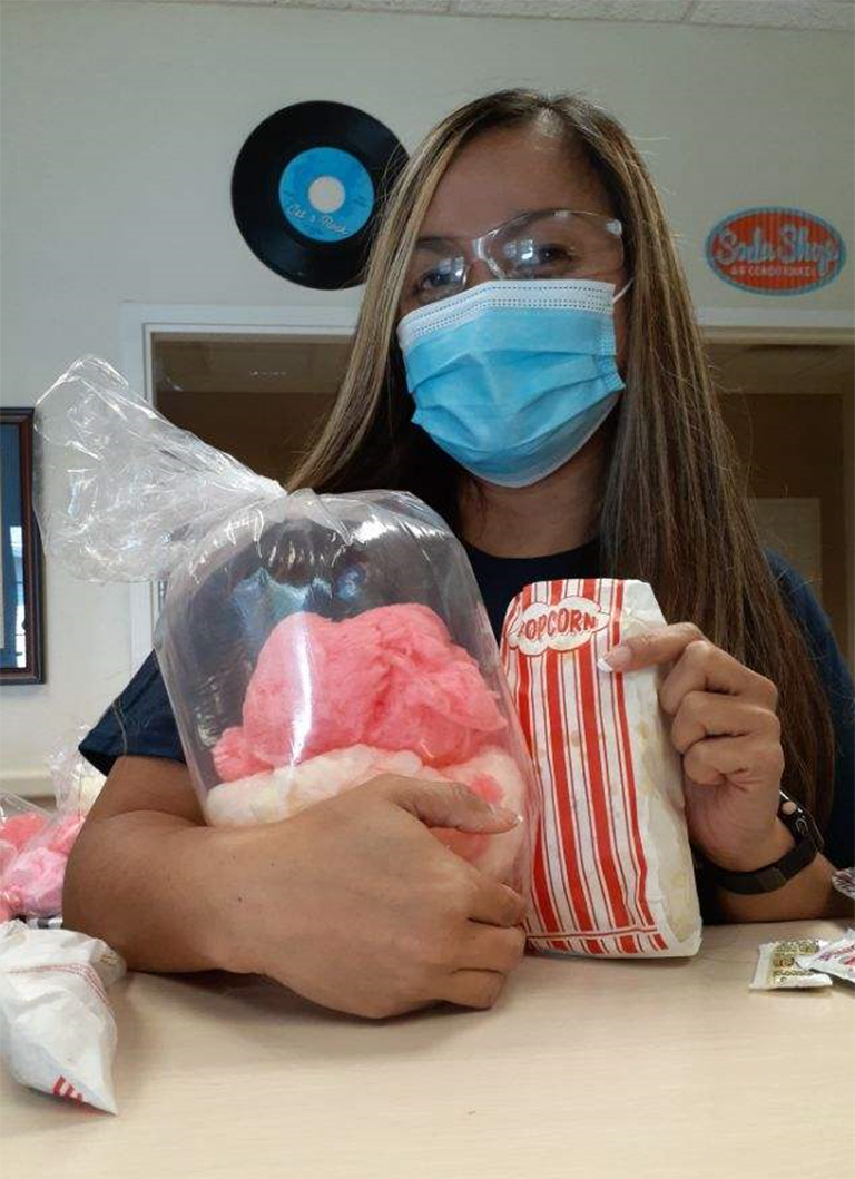 Laverne Fisher, health information manager, with her cotton candy and popcorn