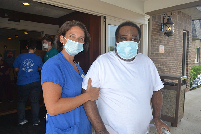 Leonard with Cortney McCarthy, physical therapist assistant