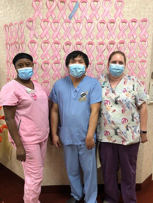 Scrubs Day, left to right: Angelina Nkum, staffing coordinator; CNAs Ramier Sta Maria and Britta Carlson