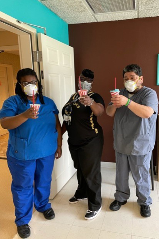 Left to right: housekeeping and laundry associates Jazmine McGill, Lissia Joshua and Oscar Chavez