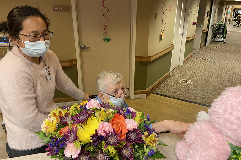 Life Care Center of the Littleton resident Louise Board with Mae Lamn, social services director, during the Easter egg hunt