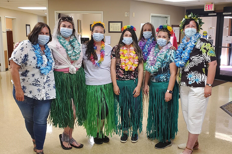 Bridgeview Estates staff members on Hawaiian Day 