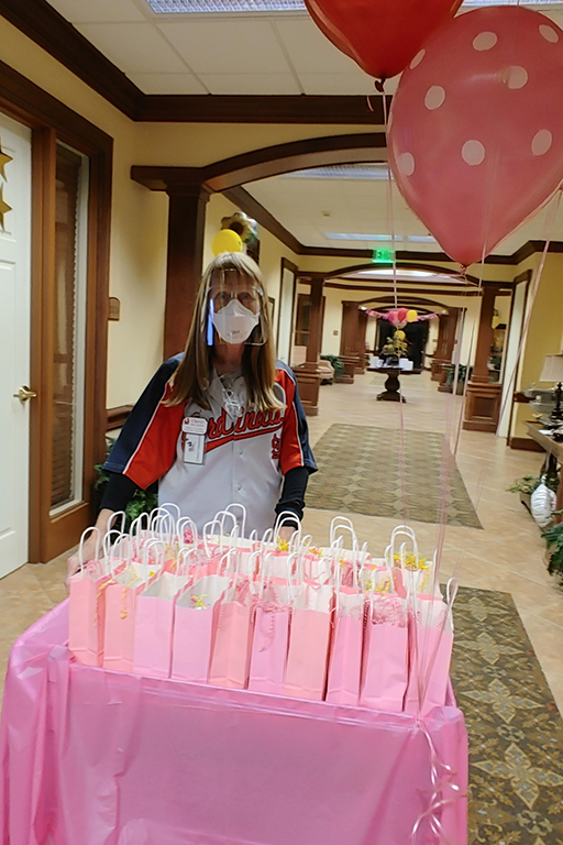 Cheryl Guetersloh, activity director at Cape Girardeau, with the Mother’s Day goody bags