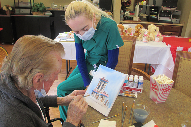 Kirkland resident Gerald Stitt painting with Izabela Ivanova, RN