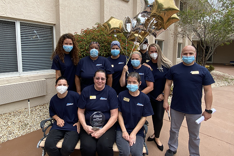 Sandra Wuest with members of the staff