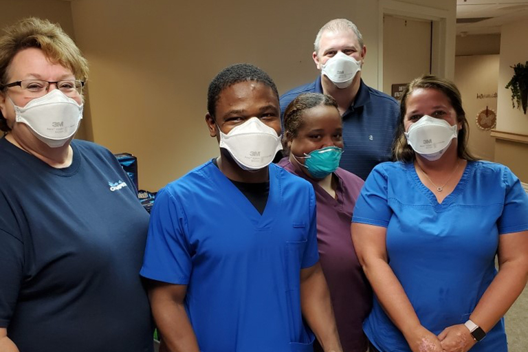 Adetayo Oduwole, LPN at LCC Wichita (center) with (left to right): Kimberly Summers, director of nursing; Lori Stewart, assistant DON; Matthew Stephenson, executive director; and Sytara Lindsay, unit manager