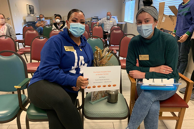 Chanelle Roer, staffing coordinator, and Bridget Boline, social services assistant, third-place winners of the pumpkin hunt at Garden Terrace Federal Way