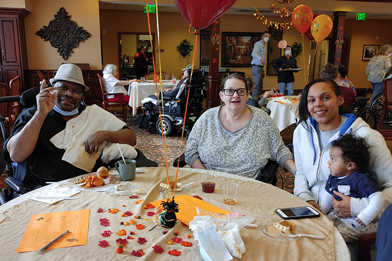 Residents Howard Ross (left) and Kim Howard (center) with family at LCC Cape Girardeau