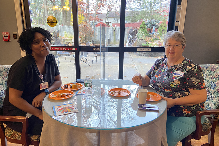 Carla Silva, certified nursing assistant (left) and Lori Bedame, unit secretary (right) at the Turkey Trot at Evergreen House