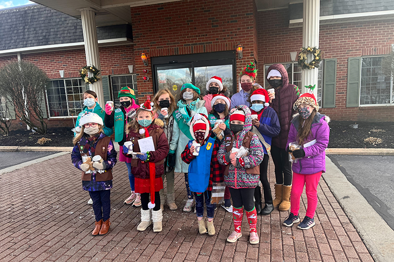 Members of the Girl Scout troop who sang at Life Care Center of Attleboro