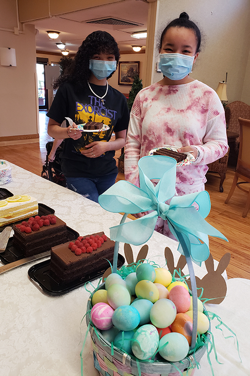 Petina Pinkney and Kalaiah Bregenzer, granddaughters of a resident, at the dessert bar at Life Care Center of Kirkland