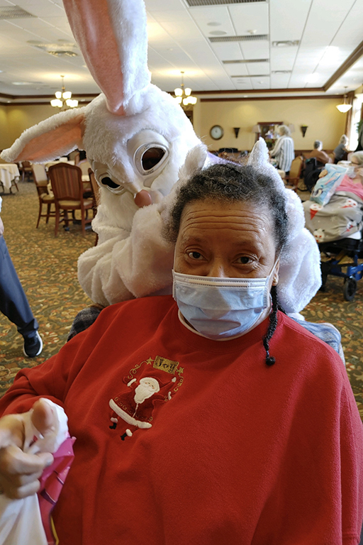 Resident Benita Wood with the Easter Bunny at Life Care Center of Cape Girardeau