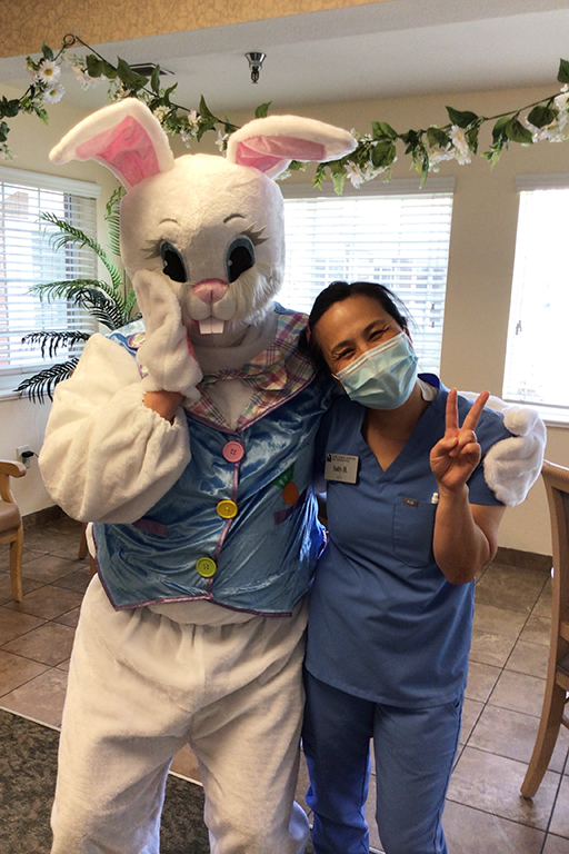 Life Care Center of Bountiful Unit Manager Travis Worthen as the Easter Bunny with Sally Hills, nurse